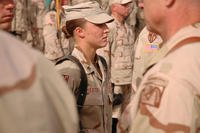 Sgt. Leigh Ann Hester stands at attention before receiving the Silver Star. (U.S. Army/Spc. Jeremy D. Crisp)