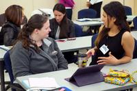 Two military spouses practice introductions as part of the &quot;Interviewing Basics&quot; session during the Spouse Career Explosion March 13 at Eglin Air Force Base, Fla. (U.S. Air Force/Sara Vidoni)