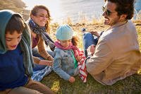 Family sitting on grass
