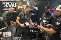 Kris Paronto signs a copy of his book &quot;The Ranger Way&quot; at SHOT Show 2018 in Las Vegas. Hope Hodge Seck/Military.com