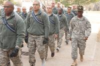 Drill Sergeant (Staff Sgt.) Jonathan Christal, B Battery, 1st Battalion, 40th Field Artillery, marches Basic Combat Training Soldiers in for classroom training. (U.S. Army Photo/Mr. James Brabenec)