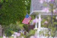 American flag on a house porch