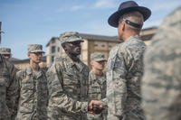 Gour Maker, a trainee at basic military training, receives an “Airman’s Coin” at the Coin Ceremony Feb. 1, 2018 outside the Pfingston Reception Center at Joint Base San Antonio-Lackland, Texas. Maker was recognized by his wingmen as a selfless leader and motivator during his time at BMT. (U.S. Air Force/Dillon Parker)