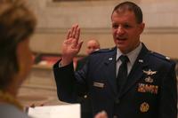 Lieutenant Colonel Bryan (Bree) Fram is an active duty astronautical engineer and transgender service member in the US Air Force promoted at the National Archives and reaffirming his oath administered by Congresswoman Madeleine Bordallo (D-GU). (SPC S. NIC MALONE - U.S. ARMY)