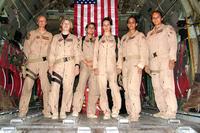 From left to right, Staff Sgt. Josie E. Harshe, flight engineer; Capt. Anita T. Mack, navigator; 1st Lt. Siobhan Couturier, pilot; Capt. Carol J. Mitchell, aircraft commander; and loadmasters Tech. Sgt. Sigrid M. Carrero-Perez and Senior Airman Ci Ci Alonzo, pause in the cargo bay of their C-130 for a group photo following their historic flight. (U.S. Air Force/ Tech. Sgt. Louis Vega)