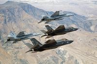 F-35C Lightning IIs, attached to the Grim Reapers of Strike Fighter Squadron 101, and F/A-18E/F Super Hornets attached to the Naval Aviation Warfighter Development Center fly over Naval Air Station Fallon's Range Training Complex on Sept. 3, 2015. (U.S. Navy photo by Lt. Cmdr. Darin Russell) 