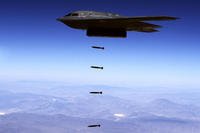 A B-2 Spirit drops inert Joint Direct Attack Munitions over the Utah Testing and Training Range at Hill Air Force Base. The bomber will soon add the B61-12 nuclear gravity bomb to its weaponry. (US Air Force photo)