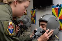 U.S. Air Force Senior Airman Darrian Caskey performs a seal check on the mask of 1st Lt. Alex Medina in the altitude hypobaric chamber for USAFSAM hypoxia demo training at Wright-Patterson Air Force Base, Ohio, April 26, 2017 (U.S. Air Force/Michelle Gigante)