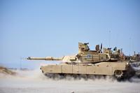 Soldiers fire a 120mm Sabot round from an M1A2 tank during a live-fire training exercise at the Idaho Army National Guard's Orchard Combat Training Center on July 26, 2018, as part of their M1A2 Tank Commanders Certification Course training. 2nd Lt. Crystal Farris/Army National Guard