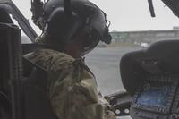 Chief Warrant Officer 3 Troy Willis performs a pre-flight inspection of a UH-60M Black Hawk, Camp Buehring, Kuwait, Feb. 27, 2018.(U.S. Army/Sgt. Thomas X. Crough)