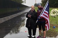 Susan Mitchell-Mattera, left, and Amy Bushatz stand at the Vietnam Veterans Memorial in Washington the day before Bushatz ran in the Marine Corps Marathon on Oct. 28 in honor of Susan's father, EM1 James C. Mitchell Jr., who was killed in Vietnam on Jan. 8, 1970. (Military.com photo)