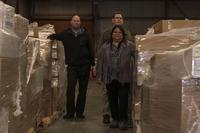 Darlene Thompson, Stephen Schultz and Joseph Gagnon, 30th Contracting Squadron civilians, pose Feb. 12, 2019, in a warehouse used for storing government property at Vandenberg Air Force Base, Calif. Their team is responsible for saving $1 billion over the course of seven years. (Airman 1st Class Hanah Abercrombie/U.S. Air Force