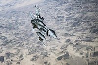 A U.S. Air Force F-16C Fighting Falcon breaks off and flies back toward its patrol area after concluding refueling operations with a KC-135 Stratotanker, assigned to the 340th Expeditionary Air Refueling Squadron Detatchment 1, over Afghanistan in support of Operation Freedom's Sentinel, March 11, 2018. (Gregory Brook/Air Force)