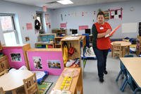 Cali Cobb walks through the Po Valley Child Development Center on Fort Drum, New York. (Mike Strasser/U.S. Army)