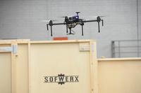 Employees of Planck Aerosystems and WiBotic demonstrate drone autonomous landing and charging technology during the ThunderDrone Rodeo at the newest SOFWERX facility in Tampa, Fla., Nov. 1, 2017. (U.S. Special Operations Command/U.S. Air Force Master Sgt. Barry Loo)