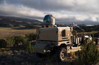 Raytheon's mobile high energy laser looks out into a wide-open sky. The company's advanced high power microwave and high energy laser engaged and defeated dozens of unmanned aerial system targets in a recent U.S. Air Force demonstration. (Photo: Raytheon)