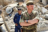 British Maj. Gen. Christopher Ghika, Combined Joint Task Force – Operation Inherent Resolve Deputy Commander is escorted through the streets of Mosul to observe the destruction caused by ISIS, Oct. 9, 2018. (U.S. Army photo)