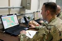 Sgt. Nicholas Maxim, acting as a member of the opposing force, builds and launches a simulated drone swarm during Exercise Dynamic Front 18 at the Joint Multinational Simulation Center, Grafenwoehr, Germany, in March, 2018. (U.S. Army/Staff Sgt. Kathleen V. Polanco, 7th Army Training Command)