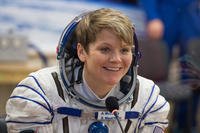 Expedition 58 Flight Engineer Anne McClain of NASA speaks with friends and family after having her Russian Sokol suit pressure checked in preparation for her launch aboard the Soyuz MS-11 spacecraft on Dec. 3, 2018, at the Baikonur Cosmodrome in Kazakhstan. (NASA/Aubrey Gemignani)