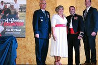 Vice Chairman of the Joint Chiefs of Staff Air Force Gen. Paul J. Selva, Holly Vega, Marine Corps Lt. Col. Javier Vega, and retired Air Force Lt. Gen. Stanley Clarke III, chairman of the Armed Forces Insurance board of directors, participate in the 2019 Armed Forces Insurance Military Spouse of the Year award ceremony at Joint Base Myer-Henderson Hall, Va., May 9, 2019.  (DoD/Todd C. Lopez)