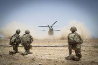 U.S. Army paratroopers secure a helicopter landing zone for a CH-47 Chinook in Kandahar Province, Afghanistan.