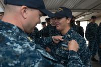 Chief Culinary Specialist Dominique Saavedra, assigned to USS Michigan, is pinned with her enlisted submarine qualification during a ceremony at Puget Sound Naval Shipyard. (U.S. Navy/Chief Mass Communication Specialist Kenneth G. Takada)