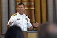 Rear Adm. Stephen Williamson addresses attendees at the command’s Lean Six Sigma Black Belt graduation ceremony in Bremerton, Wash. (U.S. Navy/Scott Hansen)