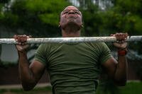 U.S. Marine Corps Sgt. Devin D. Goodall, precision measurement equipment technician, Marine Aviation Logistics Squadron 24, Marine Aircraft Group 24, knocks out his final pull-up during a motivational Marine Corps birthday event on Marine Corps Base Hawaii, Nov. 7, 2019. (U.S. Marine Corps photo/Jacob Wilson)