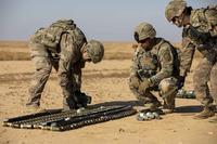 U.S. Soldiers of the 663rd Ordnance Company, 242nd Ordnance Battalion, prepare the unserviceable ammunition to be destroyed through a controlled detonation at Al Asad Air Base, Iraq, Nov. 29, 2019. (U.S. Army/Spc. Derek Mustard)