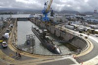 The Los Angeles-class attack submarine USS Buffalo (SSN 715) undocks from Dry Dock 2 at Pearl Harbor Naval Shipyard