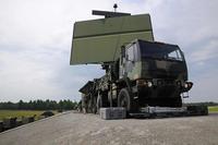 An AN/TPS-75 radar rests on the back of a transport vehicle.