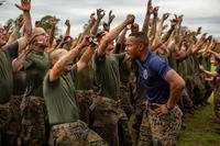 A drill instructor yells at Marine Corps recruits.