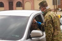 Soldiers stationed on U.S. Army Garrison Casey conduct pre-screening processes on individuals awaiting entry to the base