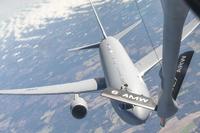 A KC-46 Pegasus approaches a KC-135 Stratotanker.