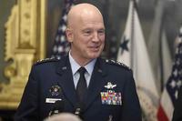 General John Raymond addresses the audience in the Executive Eisenhower Office Building, Washington, D.C.