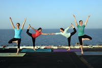 women doing yoga onboard ship