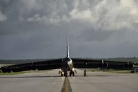A U.S. Air Force airman marshals a B-52 Stratofortress on Guam