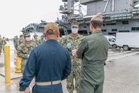 Seabees coordinate transportation of sailors from the USS Roosevelt to commercial lodging.