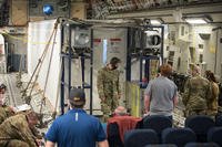 In-flight testing is conducted to certify a Negatively Pressurized Conex prototype on a C-17 Globemaster III