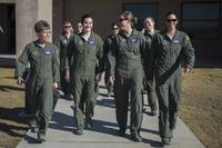A U.S. Air Force KC-135 Stratotanker aircrew walk to their aircraft on March Air Reserve Base