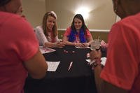 spouses' club members playing bunco