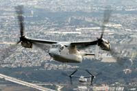 Two MV-22 Ospreys fly over San Diego.