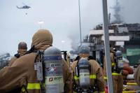 Sailors and Federal San Diego Firefighters prepare to fight a fire on board USS Bonhomme Richard (LHD 6) July 13, 2020.