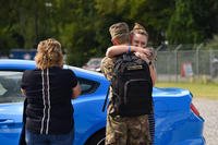 couple embraces after deployment