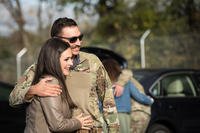 couple embracing after deployment