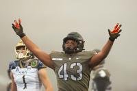 Army linebacker Jeremiah Lowery reacts during an NCAA college football game against Navy.