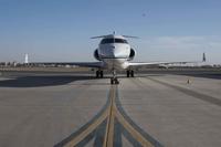 An E-11A sits on the runway at Kandahar Airfield.