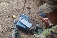 A soldier uses the &quot;EIB Pro&quot; app.