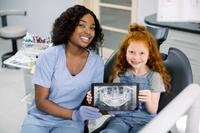 Young girl in dentist chair