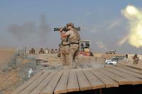 Special operations forces member fires AT-4 shoulder-fired rocket launcher.